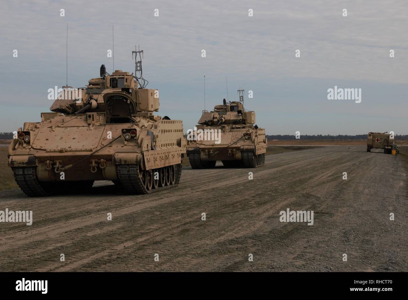 Bradley Fighting Vehicles assigned to 2nd Battalion, 69th Armored Regiment, 2nd Armored Brigade Combat Team, 3rd Infantry Division, are staged in preparation for a live firing exercise at Fort Stewart, Ga., Jan. 31. The 3rd Battalion, 15th Infantry Regiment, 2ABCT, 3ID, provided the Vehicle Crew Evaluation team for 2-69, with crews from 3-15 joining them on Feb. 1. (U.S. Army Photo by Spc. Jordyn Worshek, Released) Stock Photo
