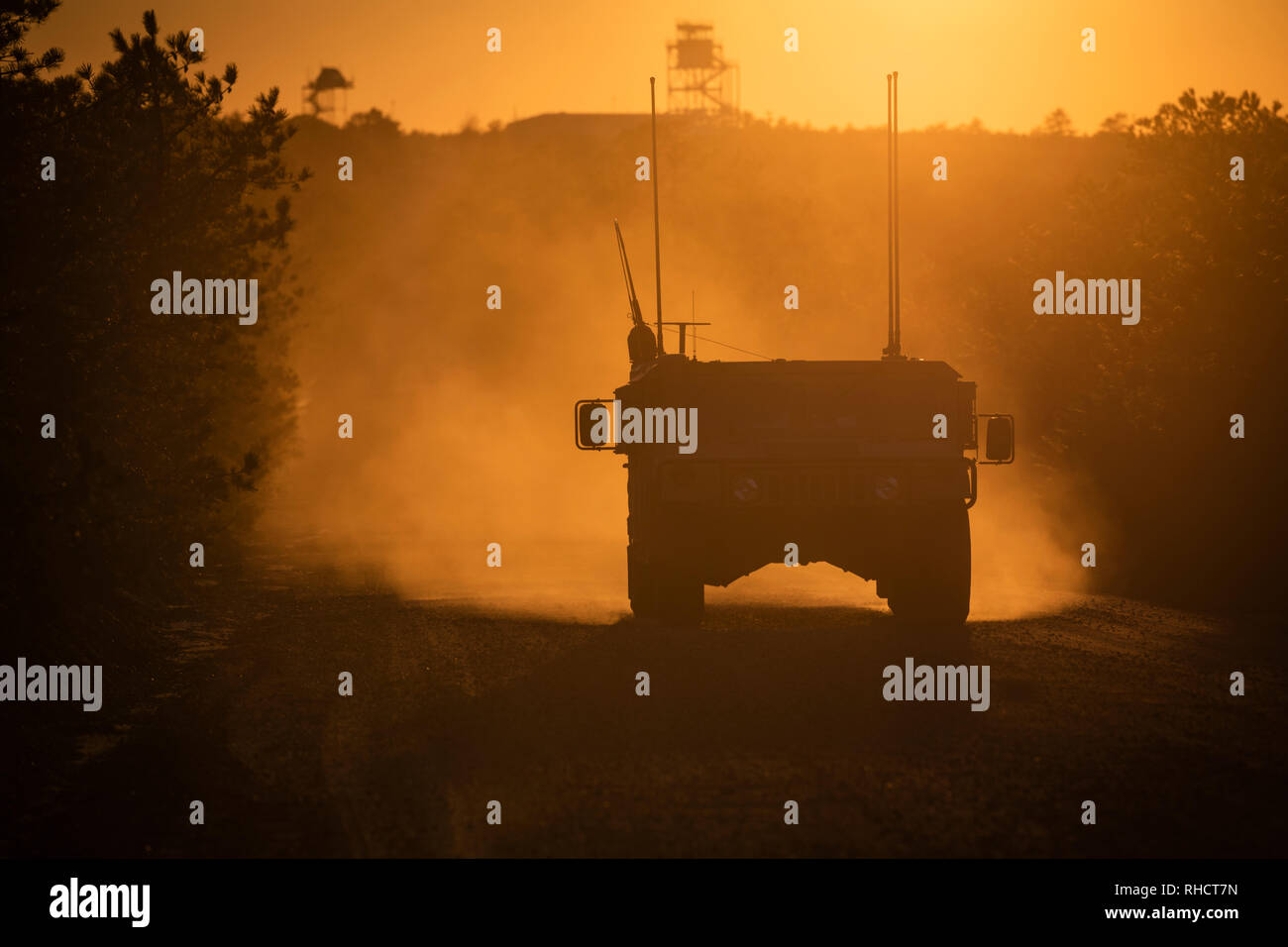 A U.S. Air Force Humvee driven by Tactical Air Control Party Airman with the New Jersey Air National Guard’s 227th Air Support Operations Squadron drives on Warren Grove Range, N.J., Jan. 31, 2019. The New Jersey Airmen trained with A-10C Thunderbolt II aircraft from the Maryland Air National Guard’s 104th Fighter Squadron as well as F-16C Fighting Falcons from New Jersey’s own 119th Fighter Squadron despite record low temperatures due to a polar vortex. The polar vortex is shuttling Arctic air across the Northeastern United States. (U.S. Air National Guard photo by Master Sgt. Matt Hecht) Stock Photo