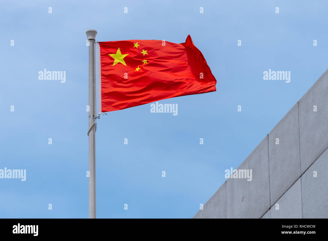 National flag of the Peoples Republic of China flying in the wind from