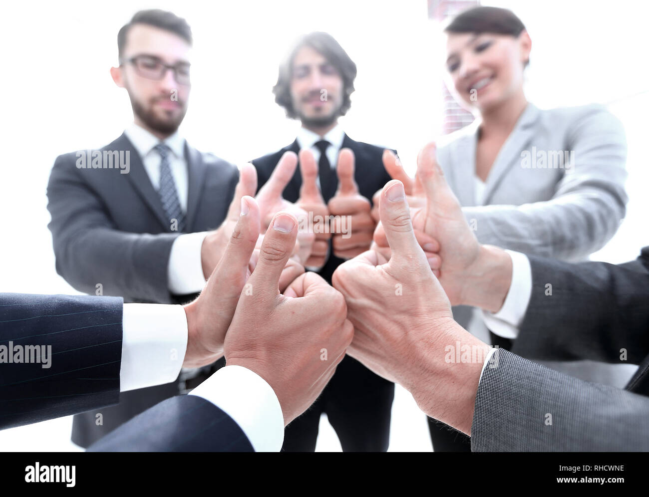 business team showing thumbs up Stock Photo - Alamy