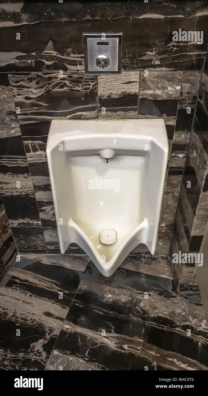 Urinal Clean has been cleaned in a toilet at a hotel in Asia Stock