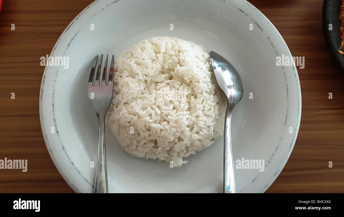 Very Hot Rice Delicious hot rice on a plate is ready to be served Stock Photo - Alamy