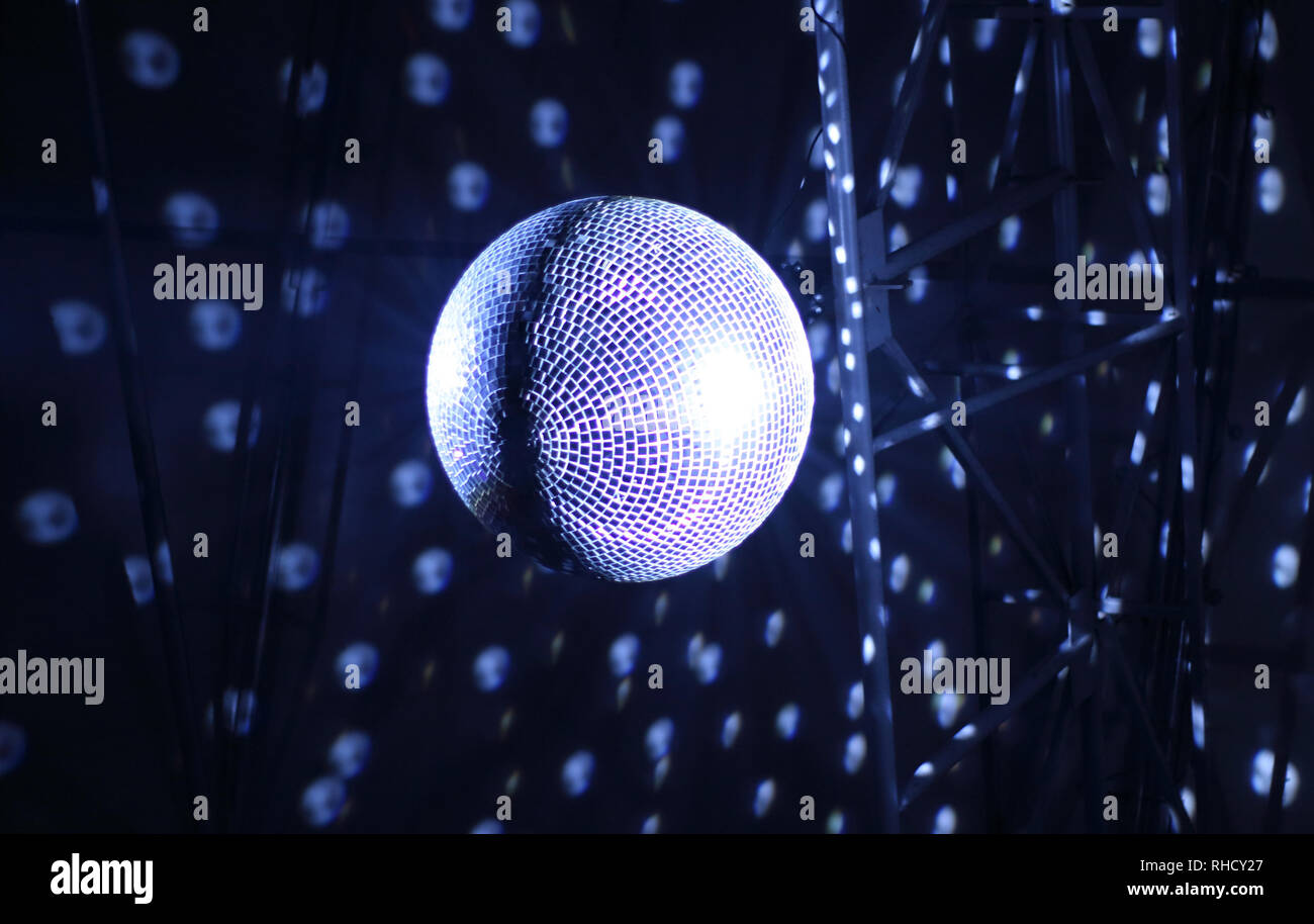 Discotheque mirror ball with pin spots and haze stock photo Stock Photo