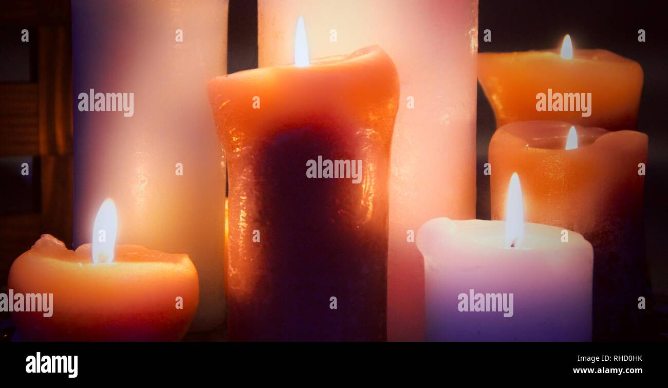 Side view of variety burning wax candles Stock Photo Alamy