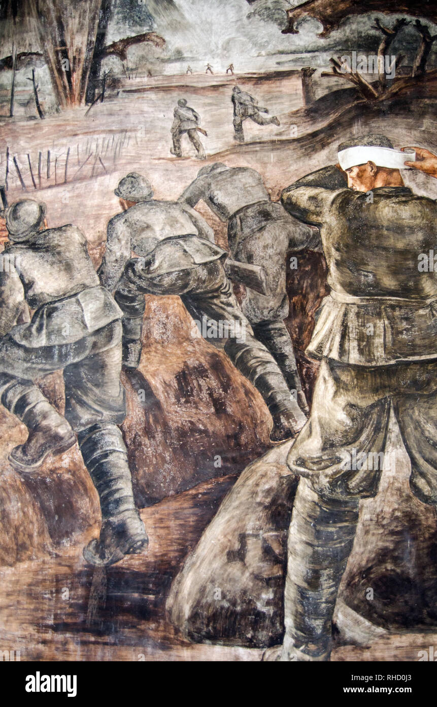 PALERMO, ITALY - JUNE 16, 2018: Mural of a battle scene with one soldier dressing his headwound while others advance on their enemy.  Exterior wall of Stock Photo