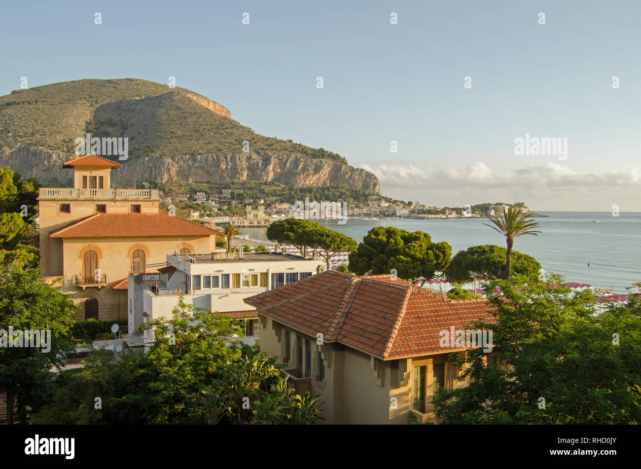 View over beachside residences towards the bay of Mondello, Palermo, Sicily on a sunny summer morning. Stock Photo