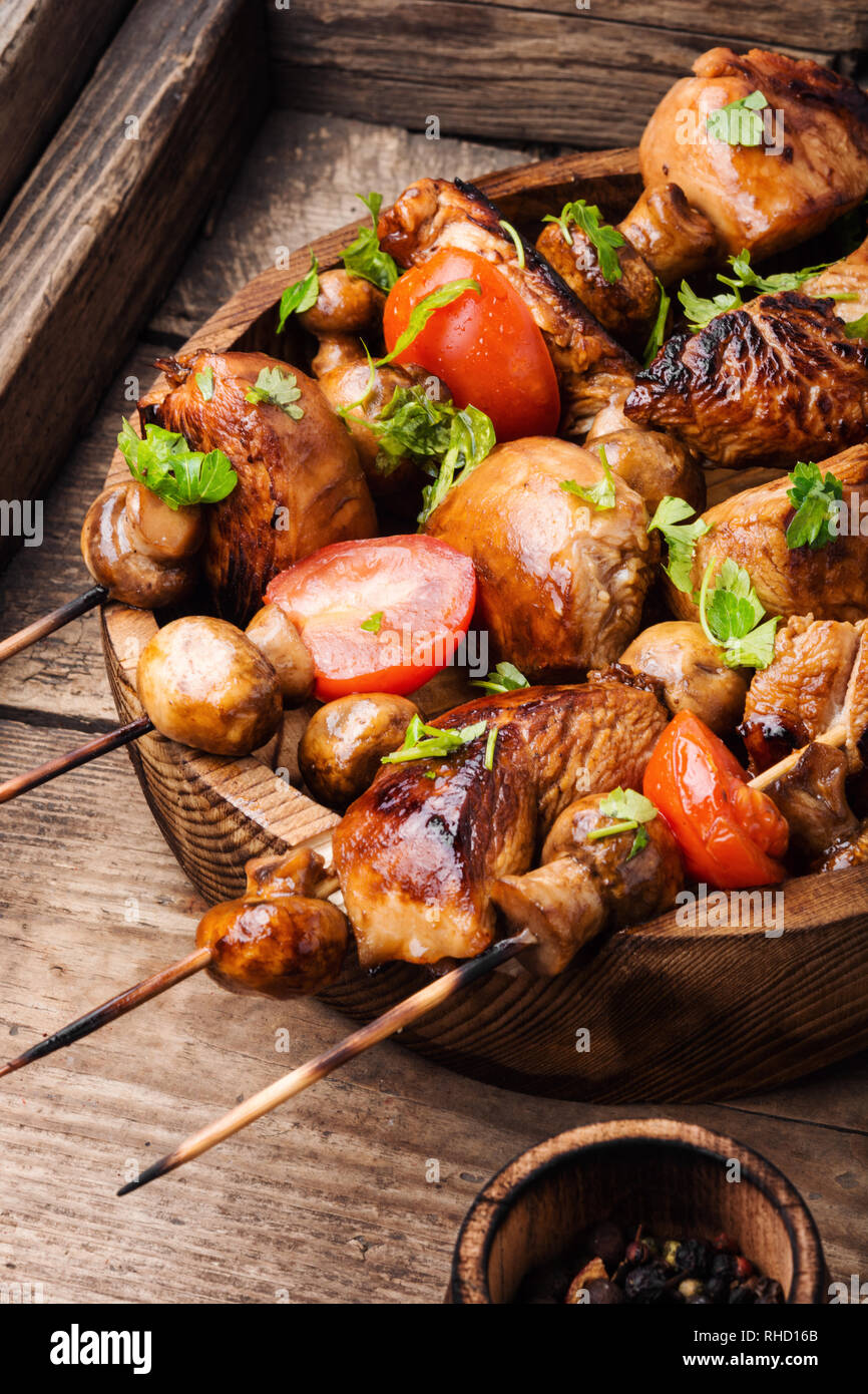 Meat chicken shish kebab with mushrooms and spices.Traditional Russian ...
