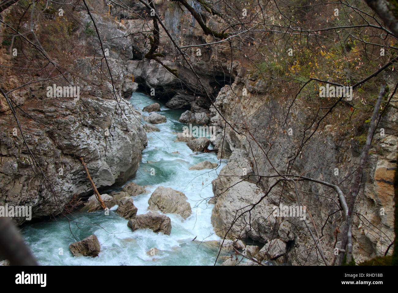 The mountain river flows among the rocks in the Khadzhokhskaya gorge. Adygea. Stock Photo