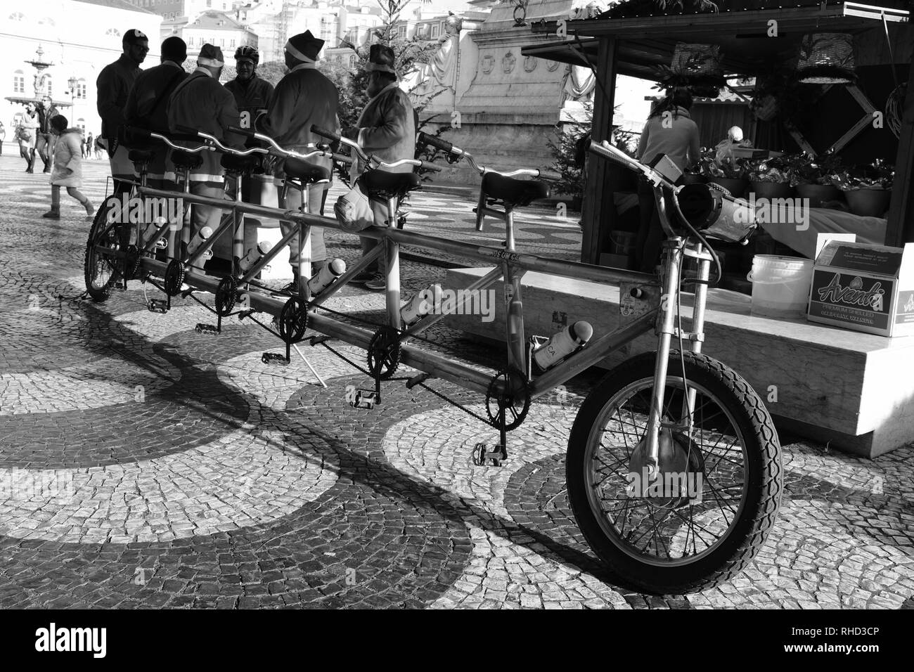 Men Dressed as Santa Claus Father Christmas riding a six seater bike Lisbon Portugal Stock Photo