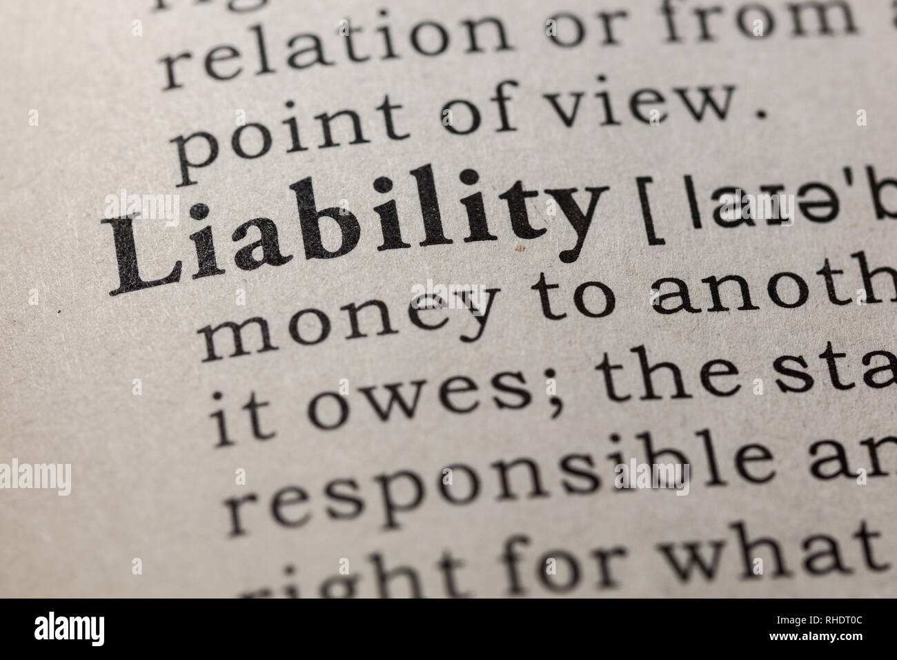 Fake Dictionary, Dictionary definition of the word liability. including key descriptive words. Stock Photo