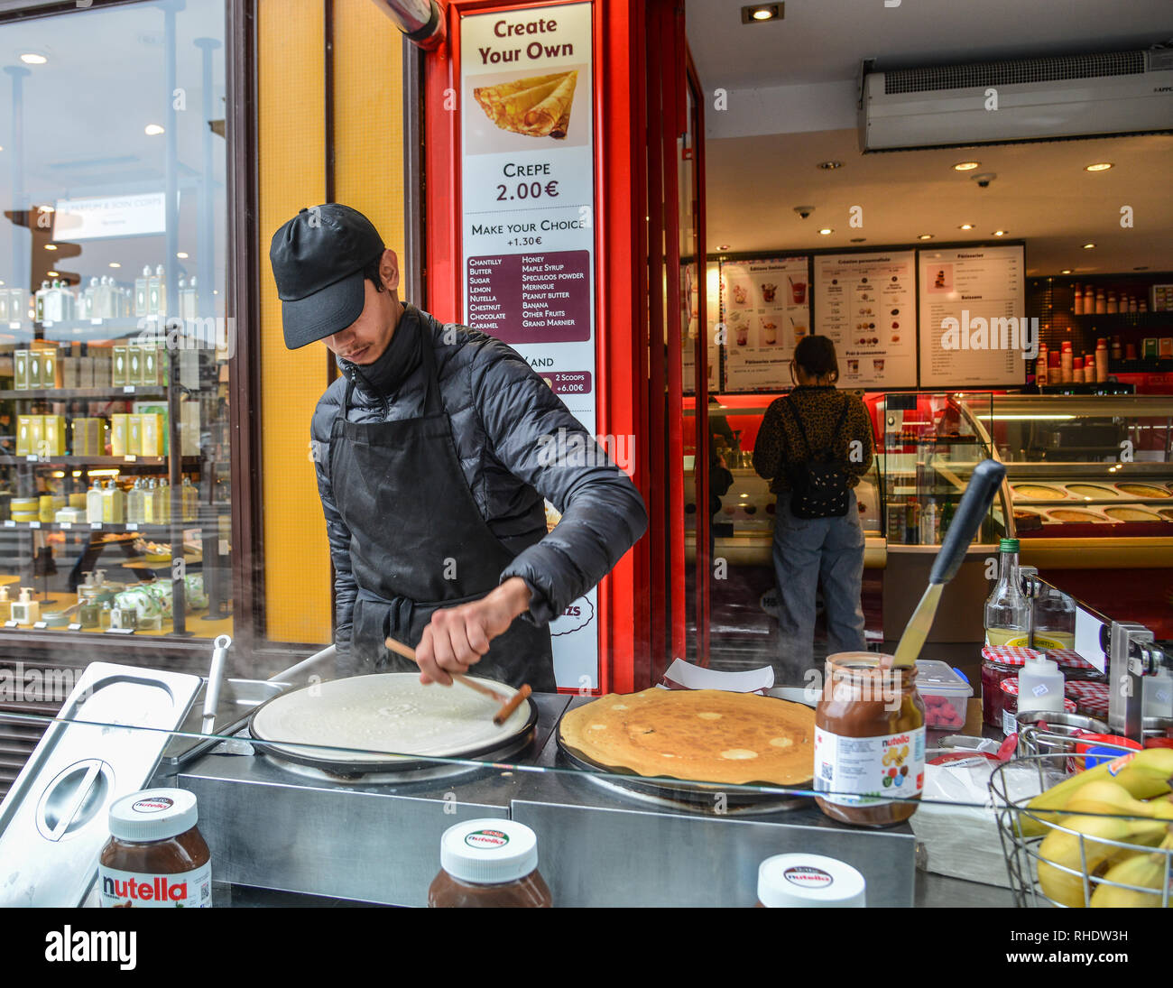 Paris, France - Oct 2, 2018. A man making crepe on street in Paris (France). Paris was ranked as the third most visited travel destination in the worl Stock Photo