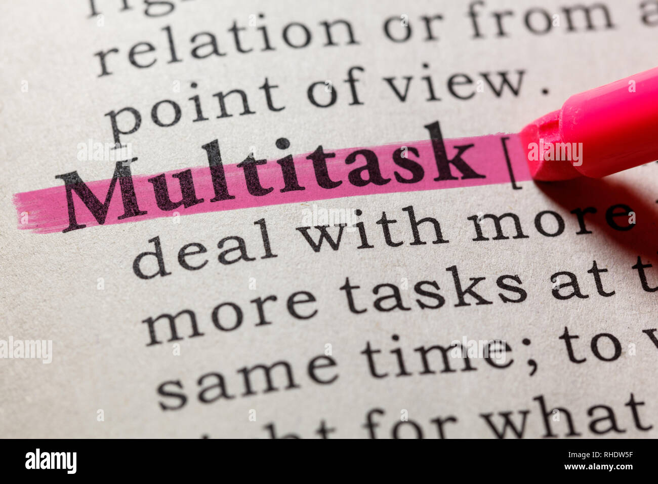 Fake Dictionary, Dictionary definition of the word multitask. including key descriptive words. Stock Photo