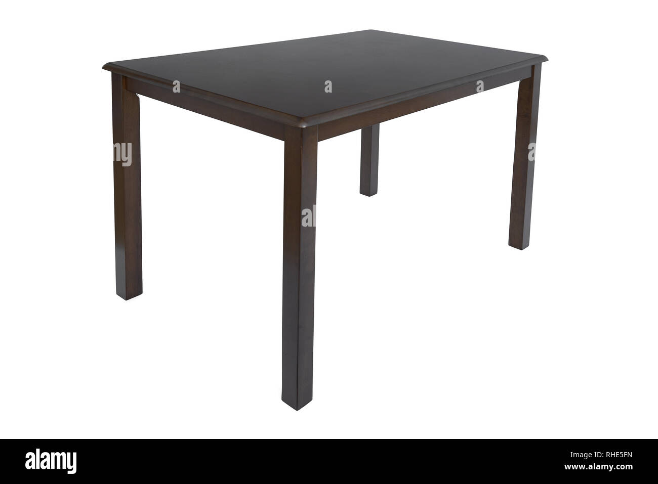 Wooden dark brown dining table for living room or kitchen. Elegant classic table for eating