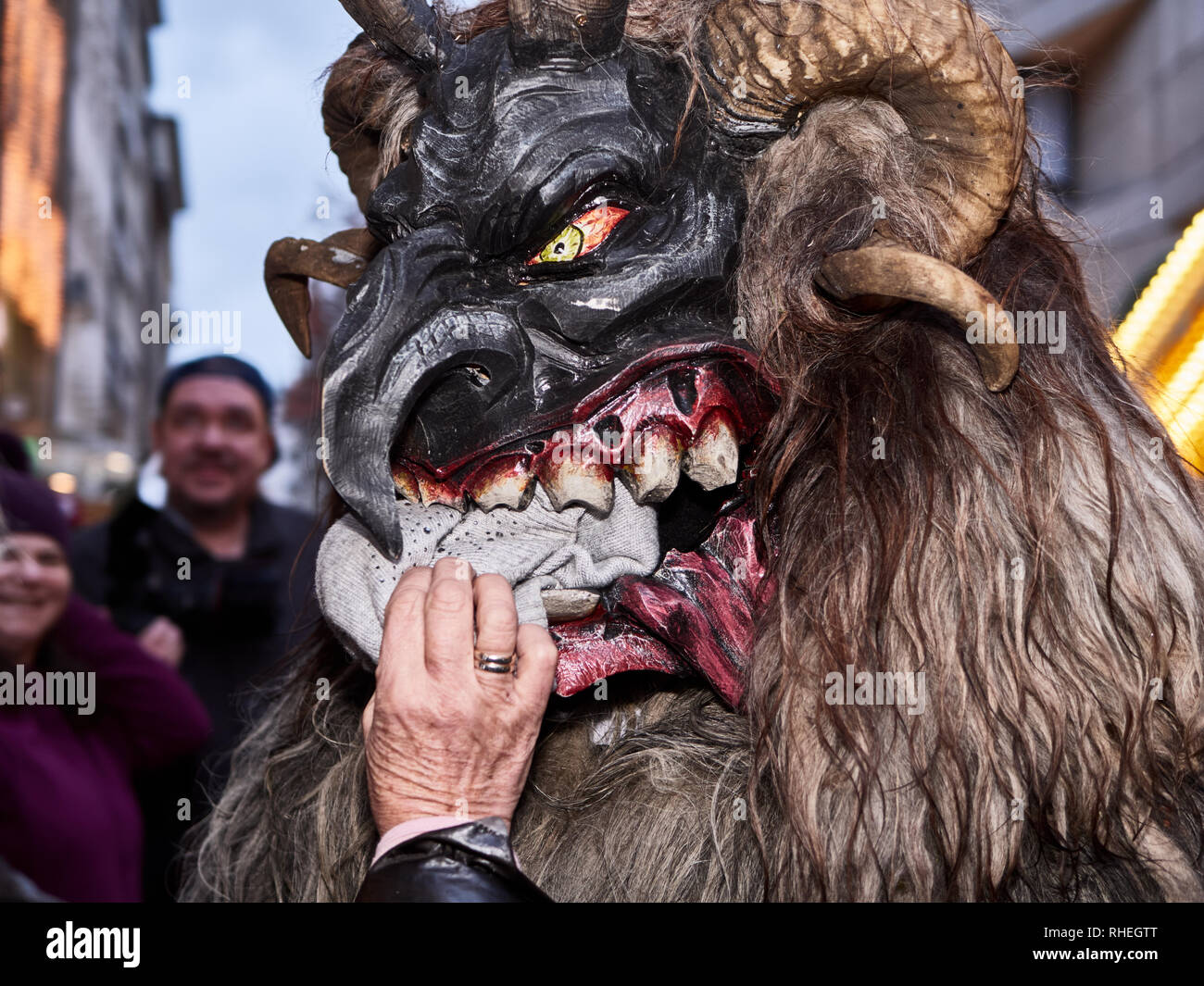 Krampus from Munich December 2018. This a devil masks made from wooden to scare people and espacially children, which from legend they tend to eat. Stock Photo