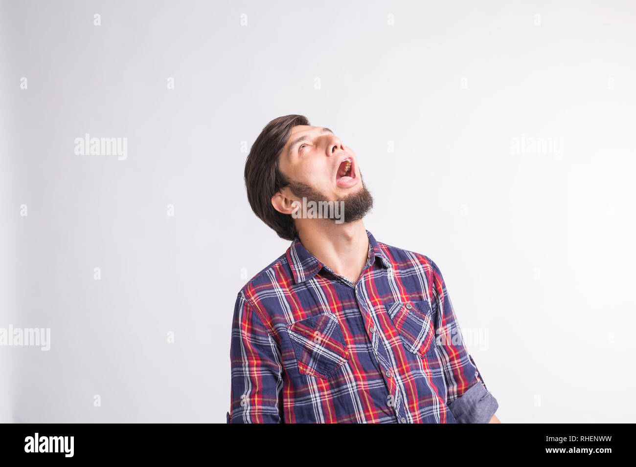 Shocked and surprised face of arab man looking up isolated on white ...