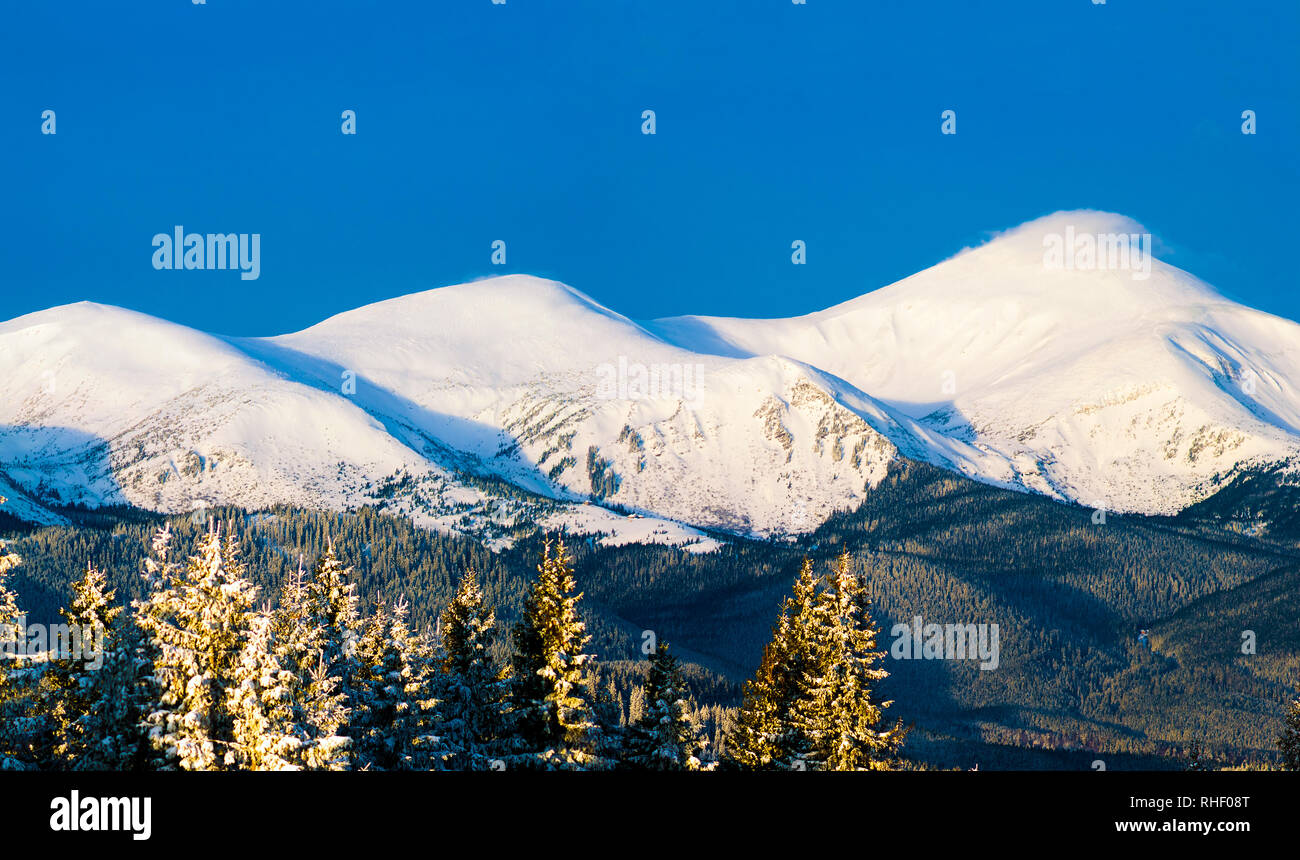 Morning mountain view. Three snowy peaks. Ukraine. Carpathians Stock Photo