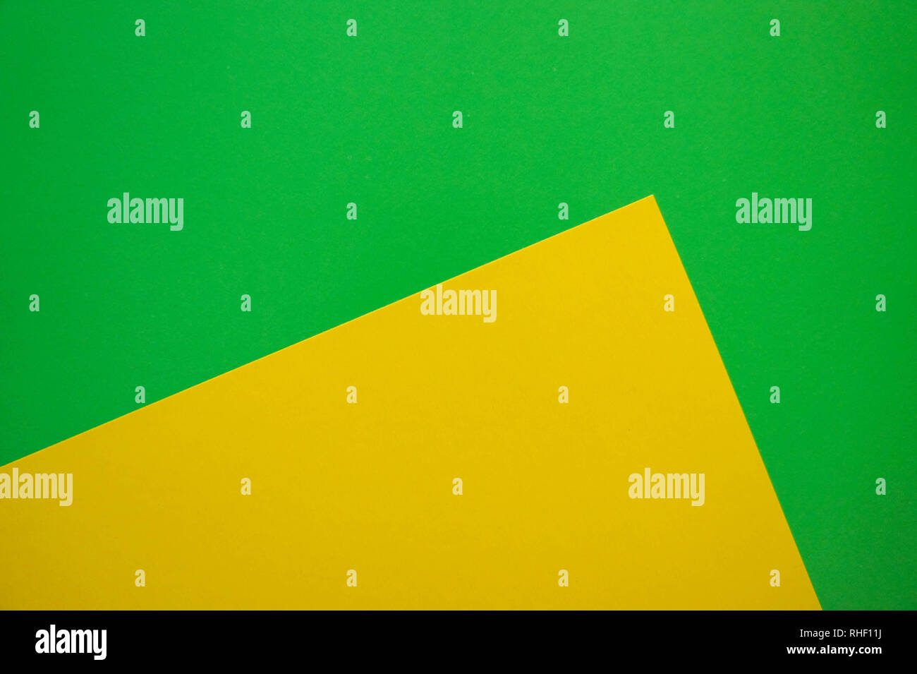 Modern flat lay background with color paper sheets. Yellow and green ...