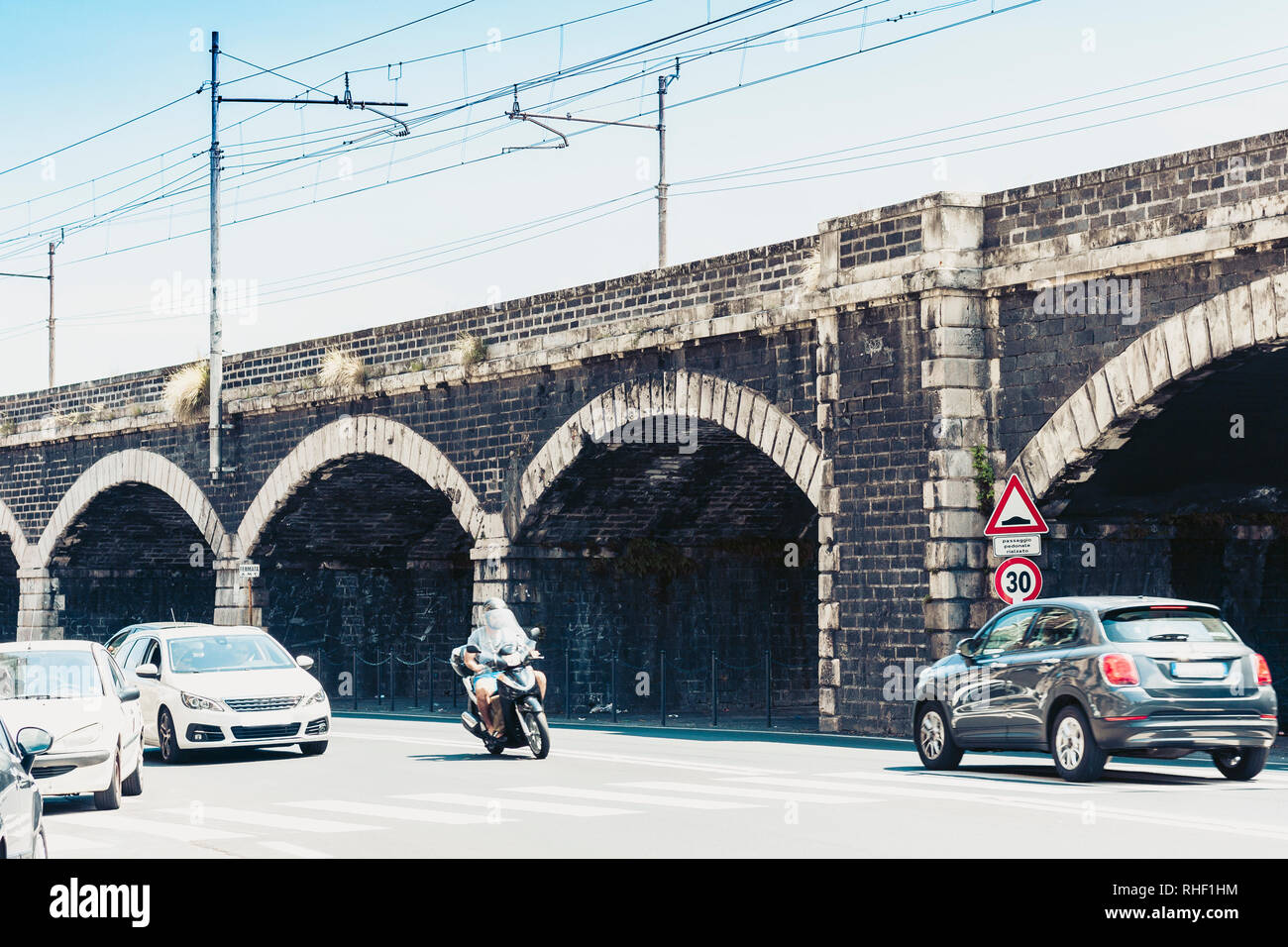 Old stone port bridge Archi della Marina  in Catania, Sicily, Italy Stock Photo