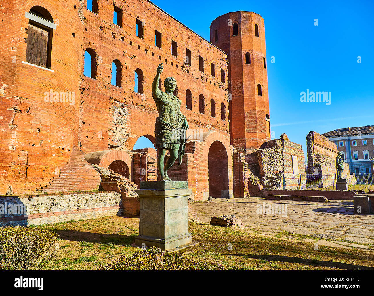 Statue of Augustus Caesar in front of Porta Palatina Gate. Piazza Cesare Augusto square. Turin, Piedmont, Italy. Stock Photo