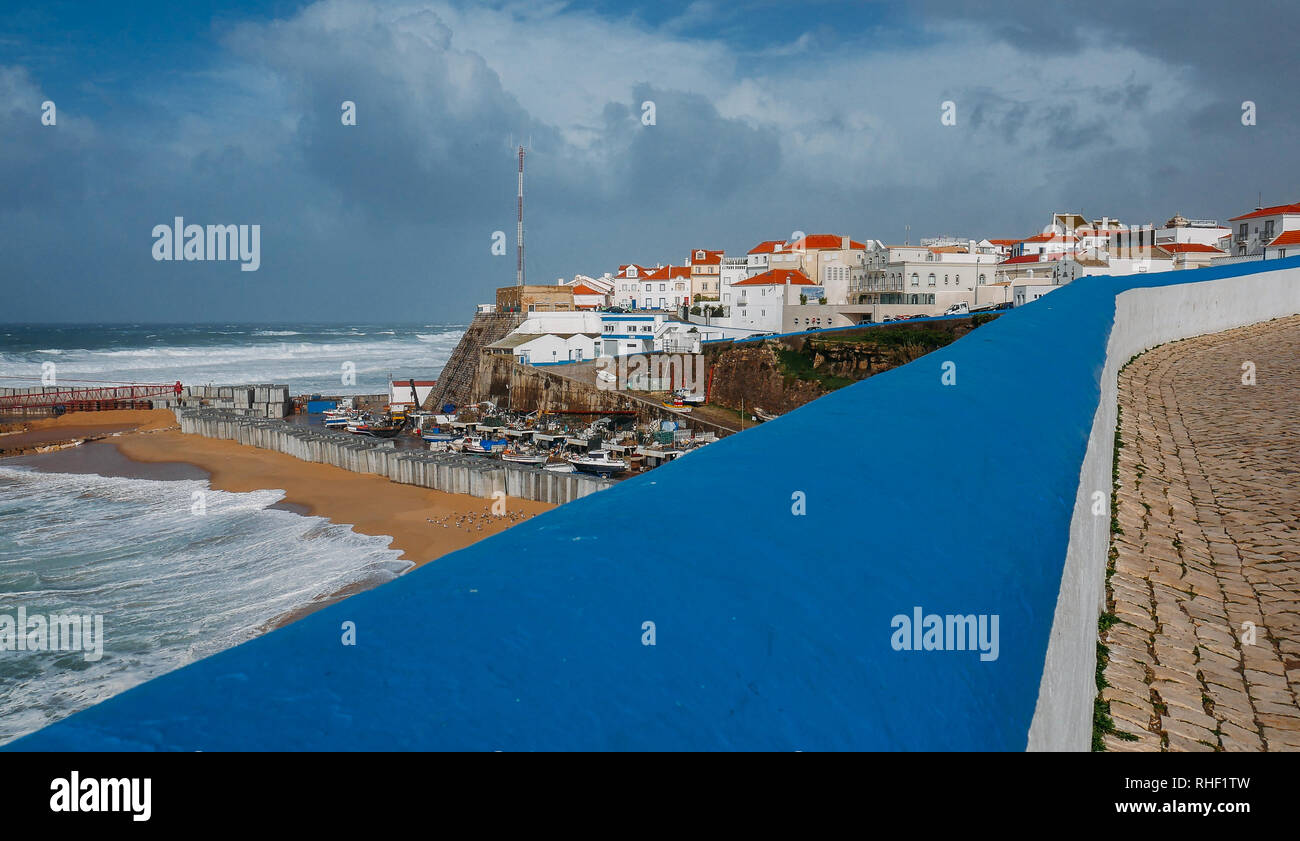 General view of Ericeira beach and houses under a cloudy winter sky, Portugal. Stock Photo