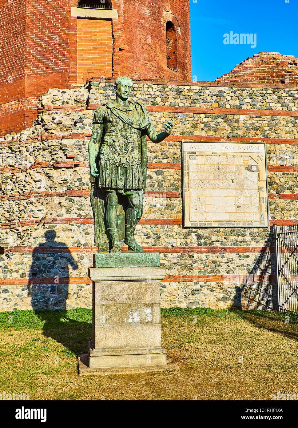 Gaius Julius Caesar Statue in front of Porta Palatina Gate. Piazza Cesare Augusto square. Turin, Piedmont, Italy. Stock Photo