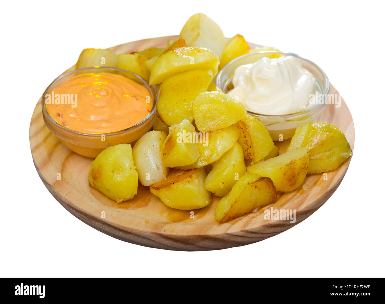 Plate of traditional Spanish tapas Patatas Bravas with sauces