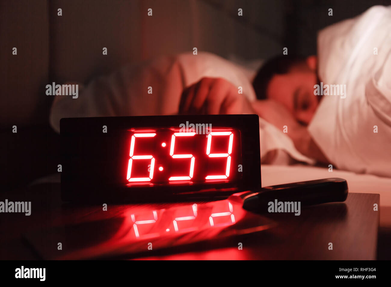 Alarm Clock On The Bedside Table With Red Numbers Kitchen Knife