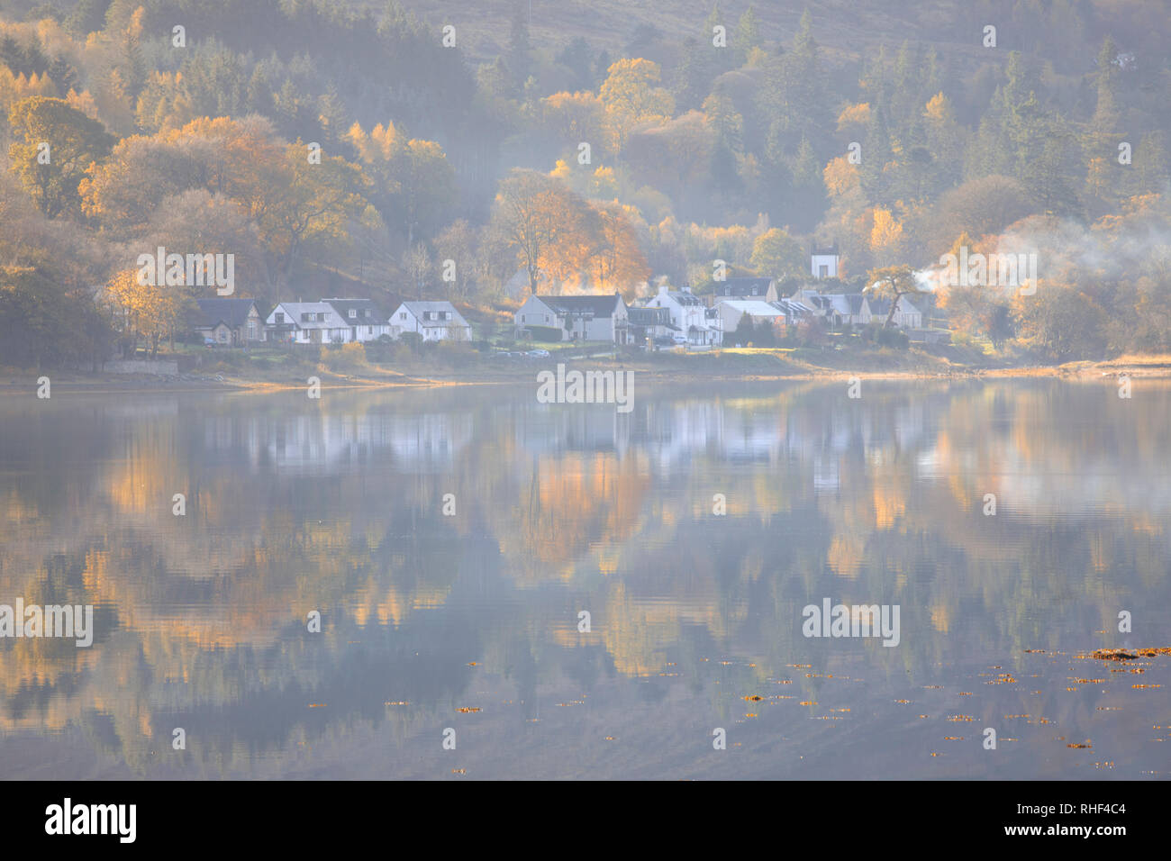 Cairndow reflected in Loch Fyne. Stock Photo