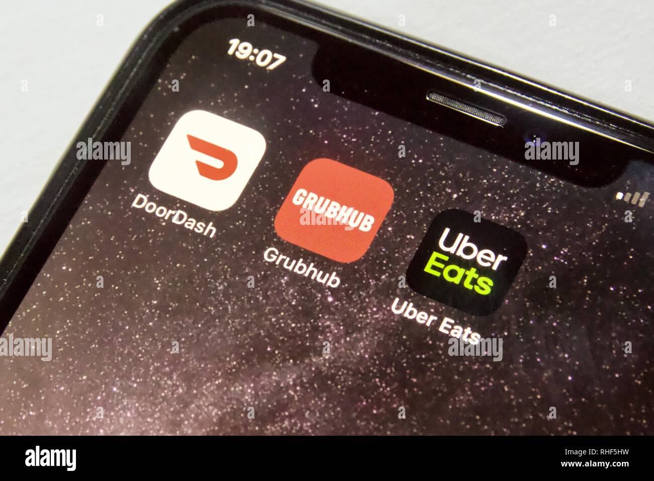 Food delivery apps on an iPhone - DoorDash, GrubHub and UberEats Stock Photo