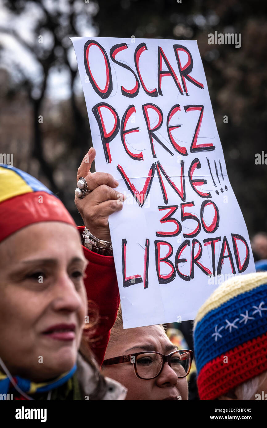 A protester is seen holding a placard in memory of Oscar Perez who was killed in a confrontation with the Venezuelan police during the protest. Members of the Venezuelan community in Barcelona who support interim President Juan Guaidó have gone out to ask for free elections in Venezuela. Stock Photo