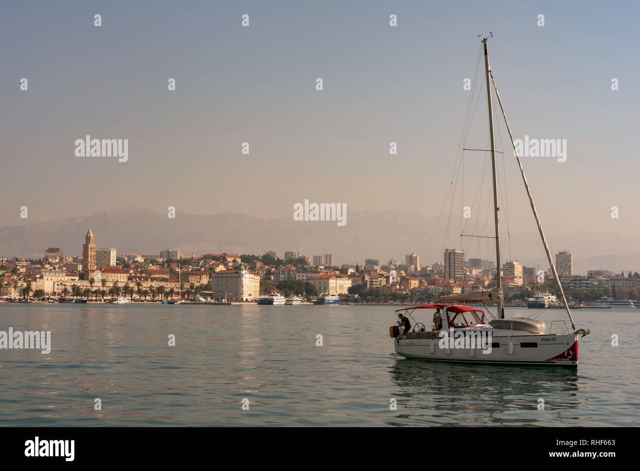 A sailboat leaves the harbor in Split, Croatia Stock Photo