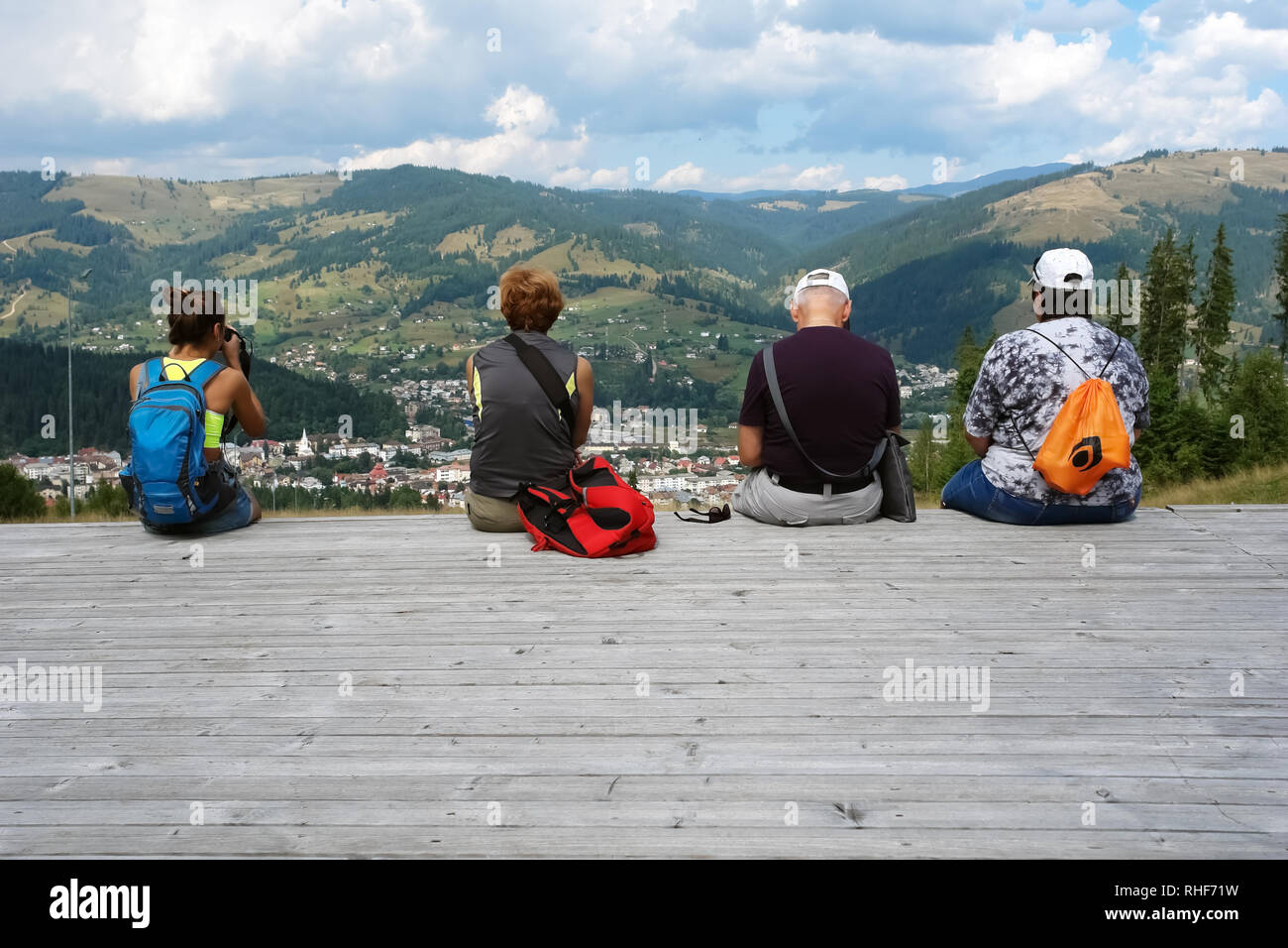 Vatra Dornei, Romania - August 20, 2016: Tourists are watching a panorama of the city of Vatra Dornei and the Carpathian Mountains a summer morning, R Stock Photo
