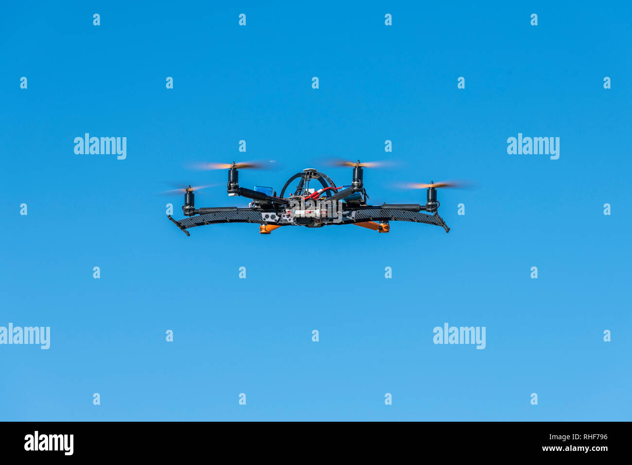 Professional drone hovering in a test flight session Stock Photo
