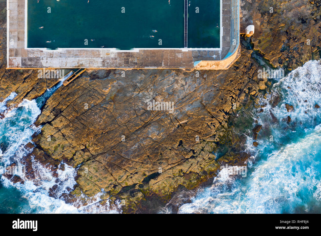 Aerial view of Newcastle baths and rocky shoreline. Newcastle baths are
