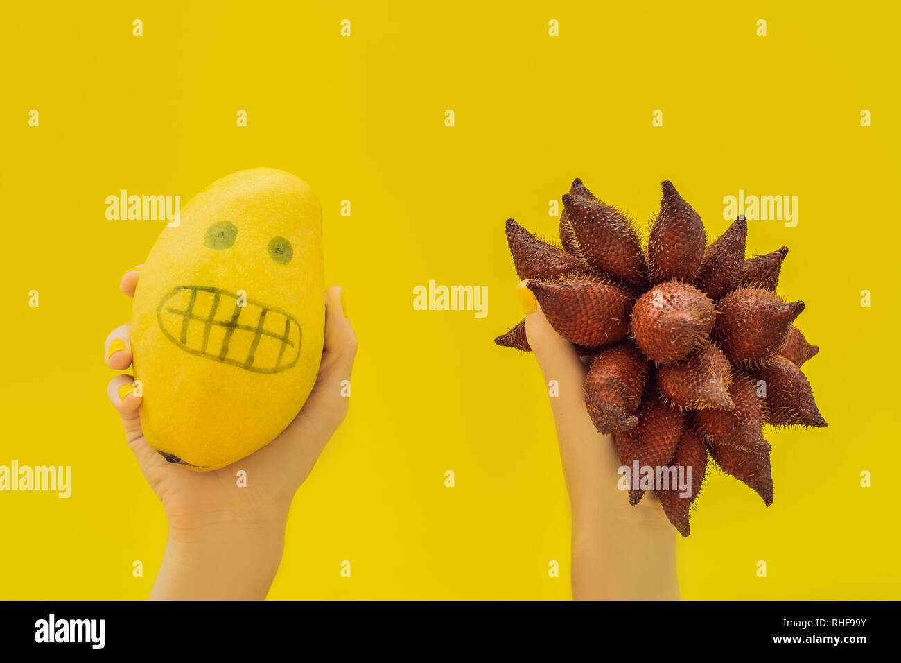 Tropical fruits mango and salak. Smooth mango scared spiny salak. Tropical fruit allergy, fear