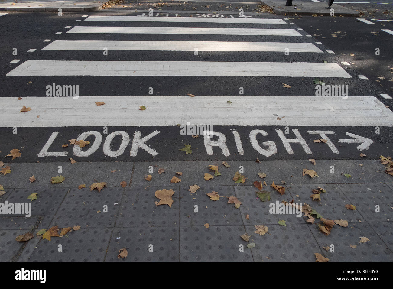 Pedestrian crossing with markings look right on the road to help