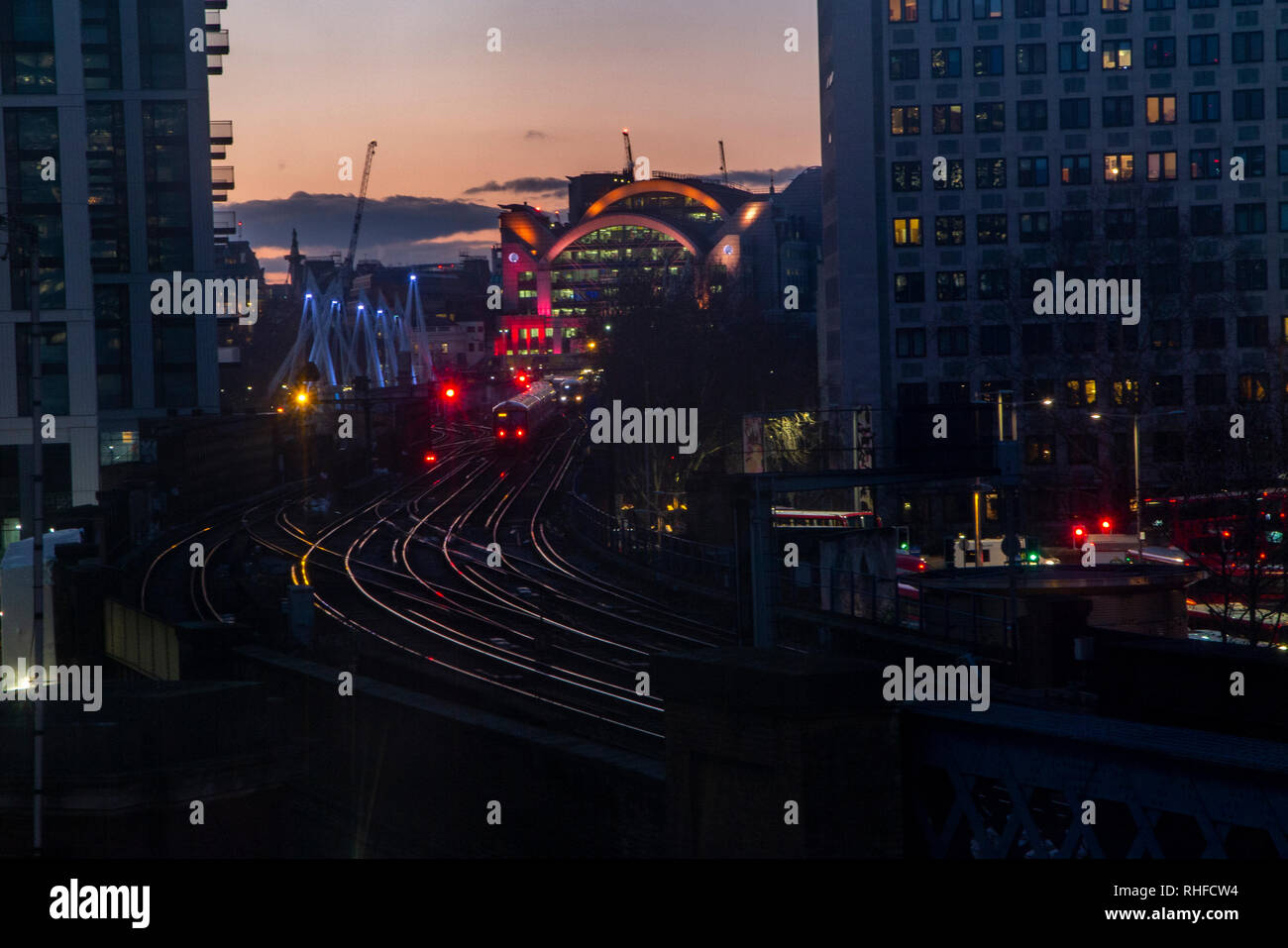 Trains going to and from Charing Cross station in London  at night Stock Photo