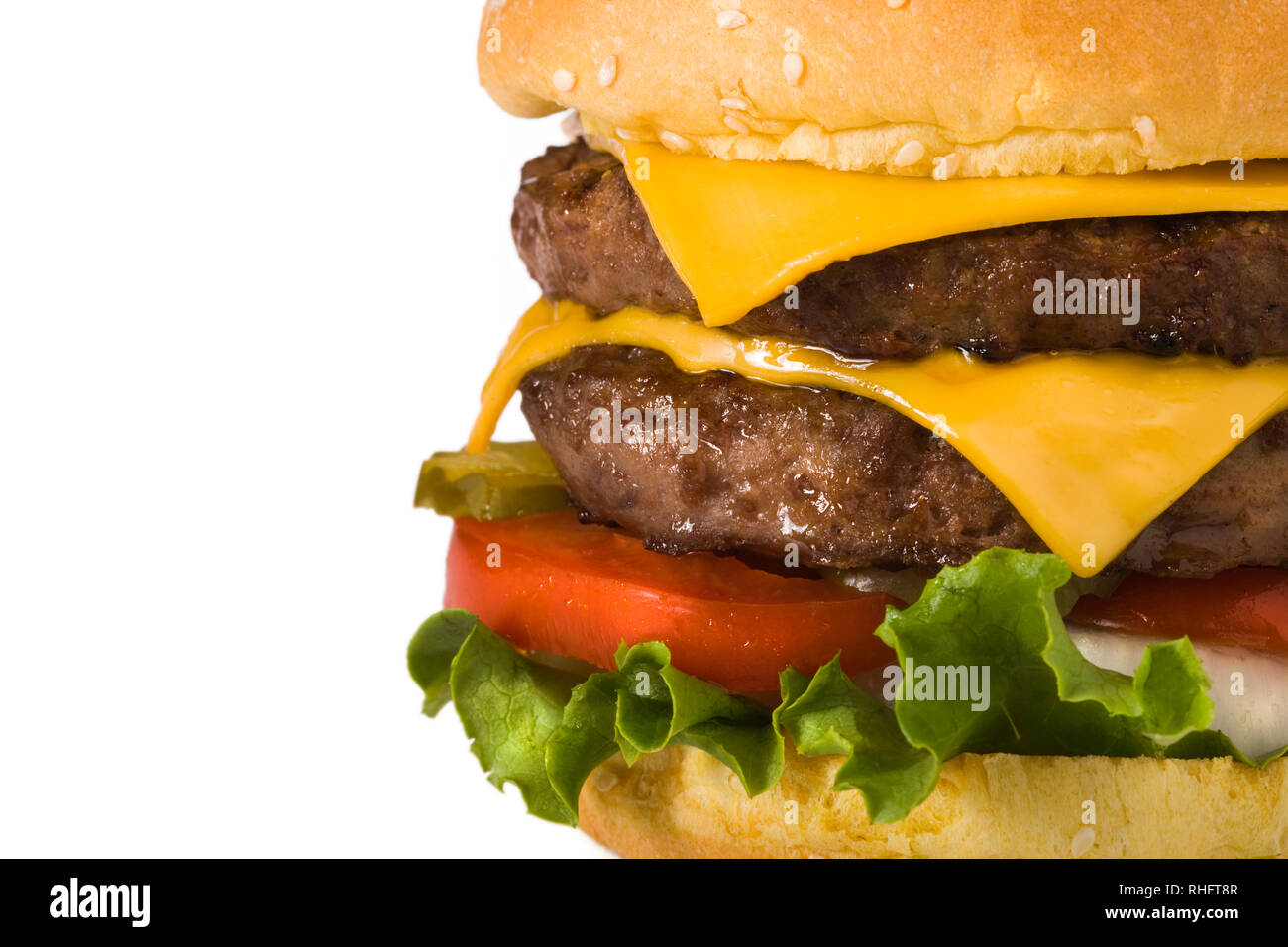 Giant double meat, double cheeseburger on white backdrop Stock Photo