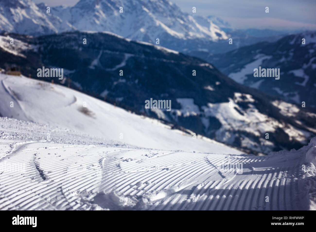 Close-up groomed snow at ski resort, slope banner background texture Stock Photo