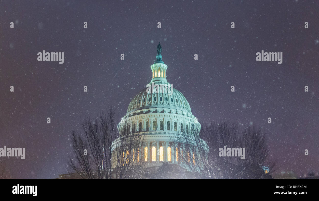 Snow flakes fall over the United States Capitol Building dome as a snowstorm passes through the Washington, D.C. area Stock Photo