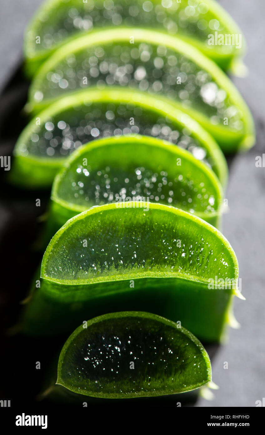 Aloe Vera Slices Stacked On Dark Board Gel Inside Aloe Leaf
