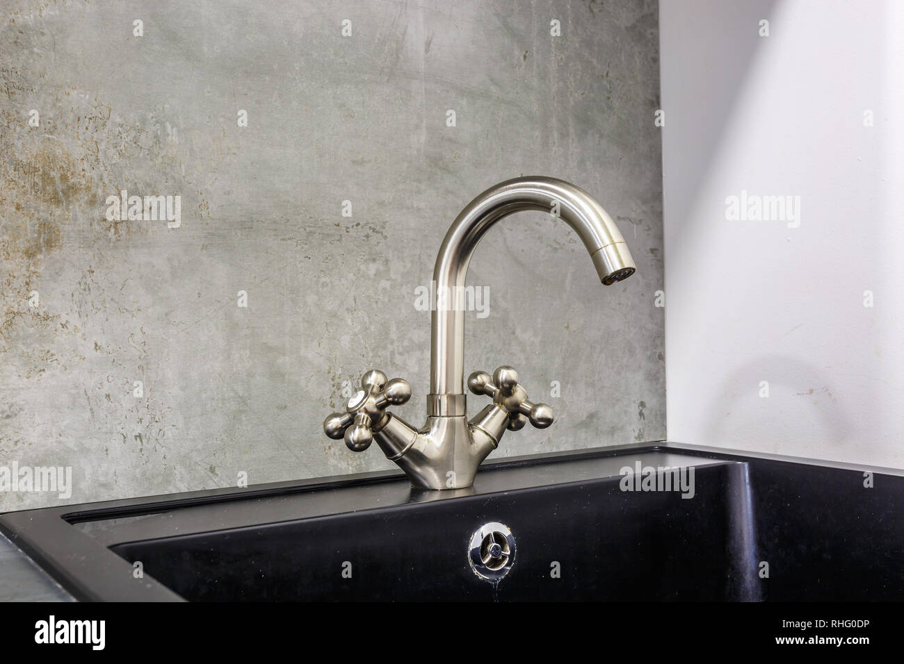 Steel Water Tap Sink With Faucet In Expensive Loft Kitchen Stock