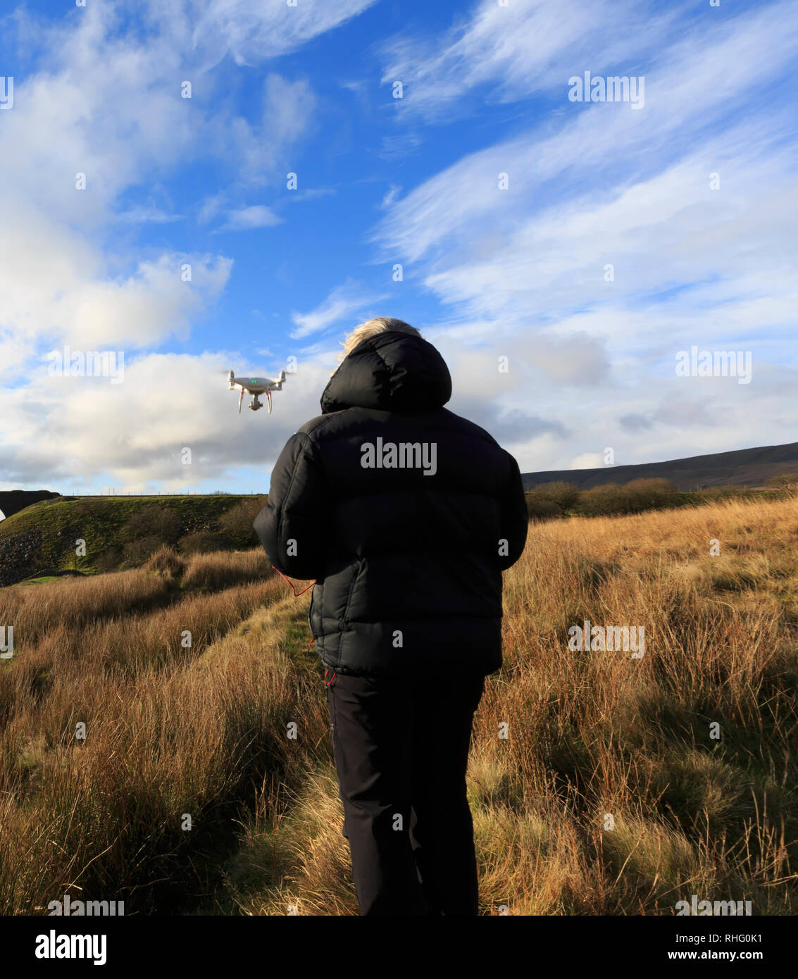 Drone being operated above moorland Stock Photo