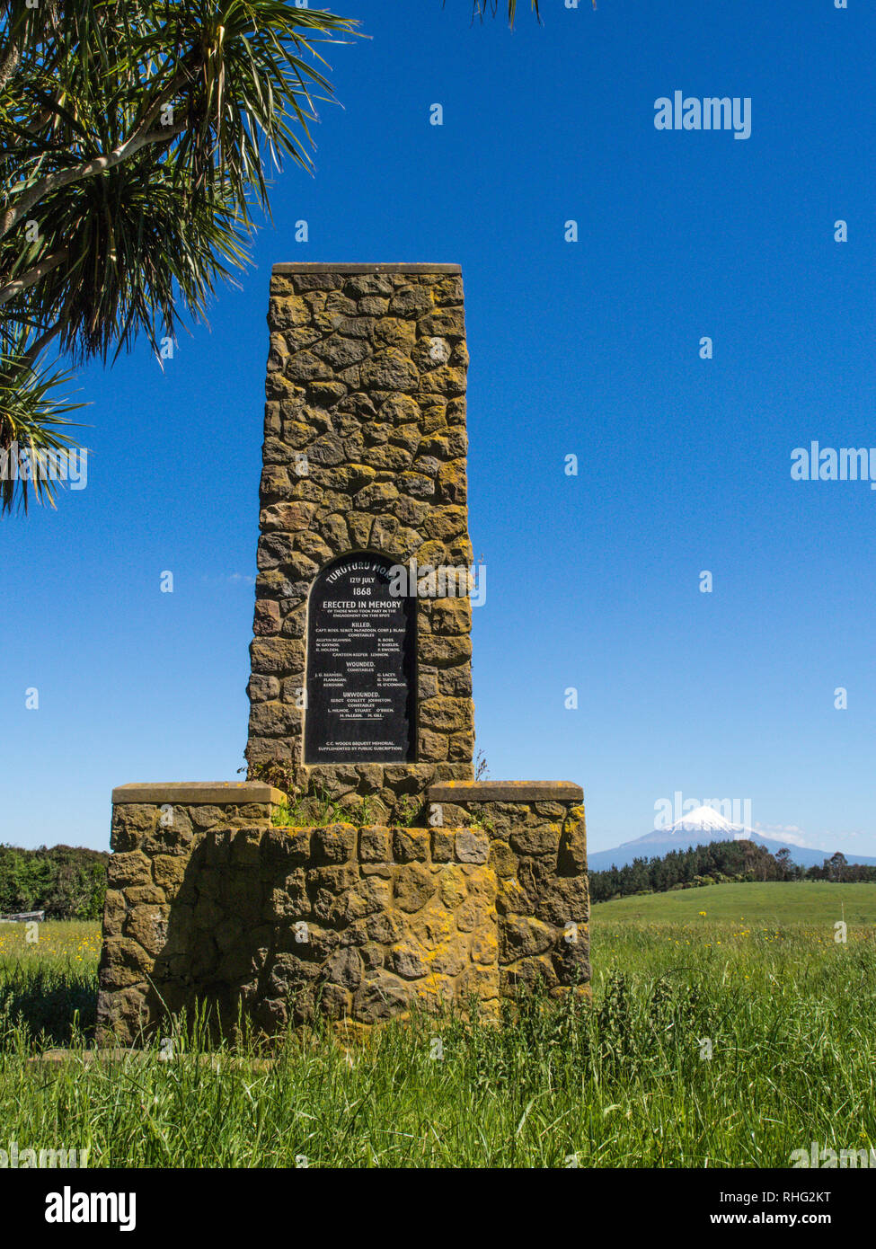 War Memorial Cairn at Turuturu Mokai battlefield, with Taranaki mountain in background, Hawera, South Taranaki, New Zealand Stock Photo