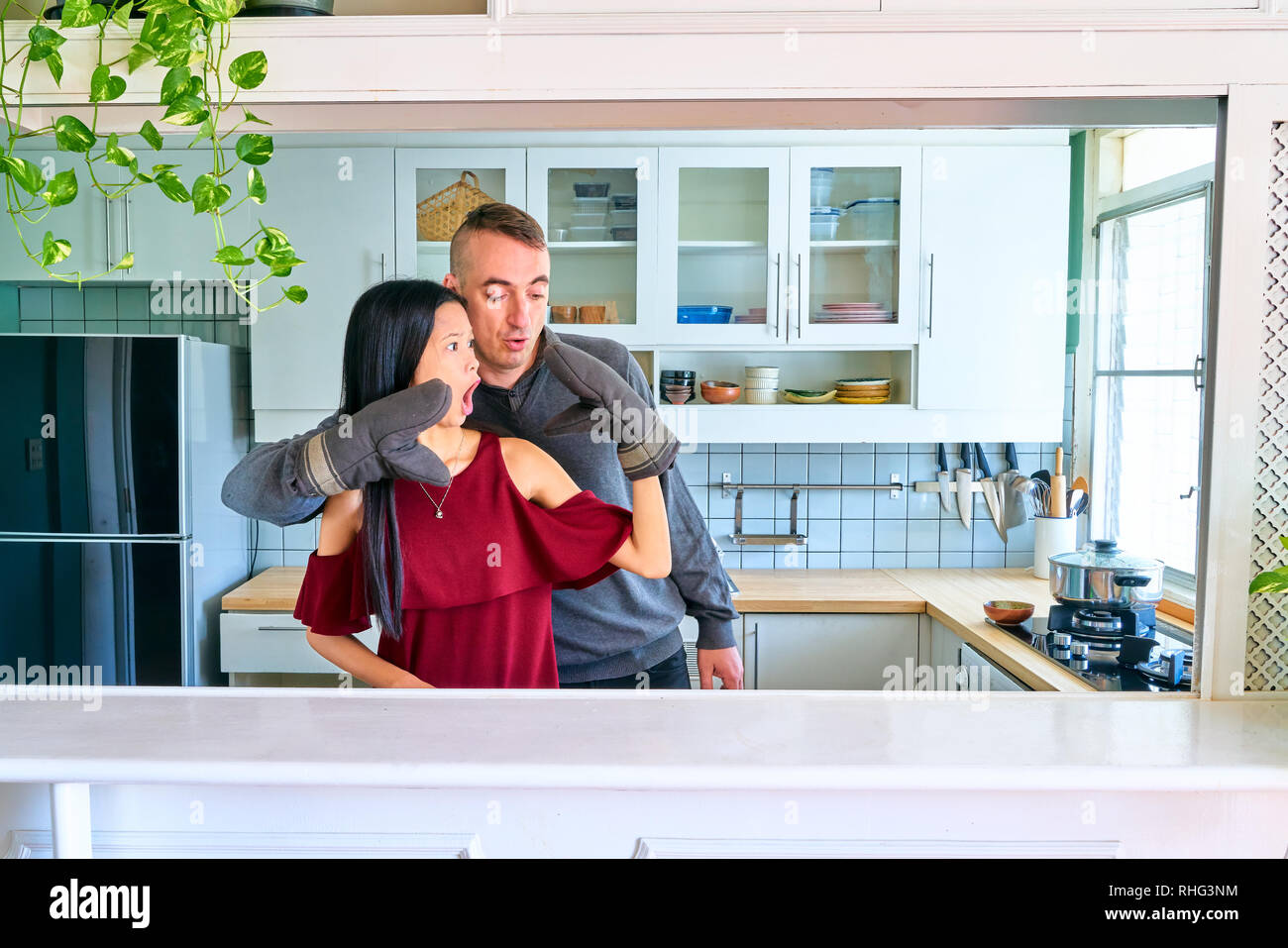 Lovely couple posing - playing the puppet hands Stock Photo