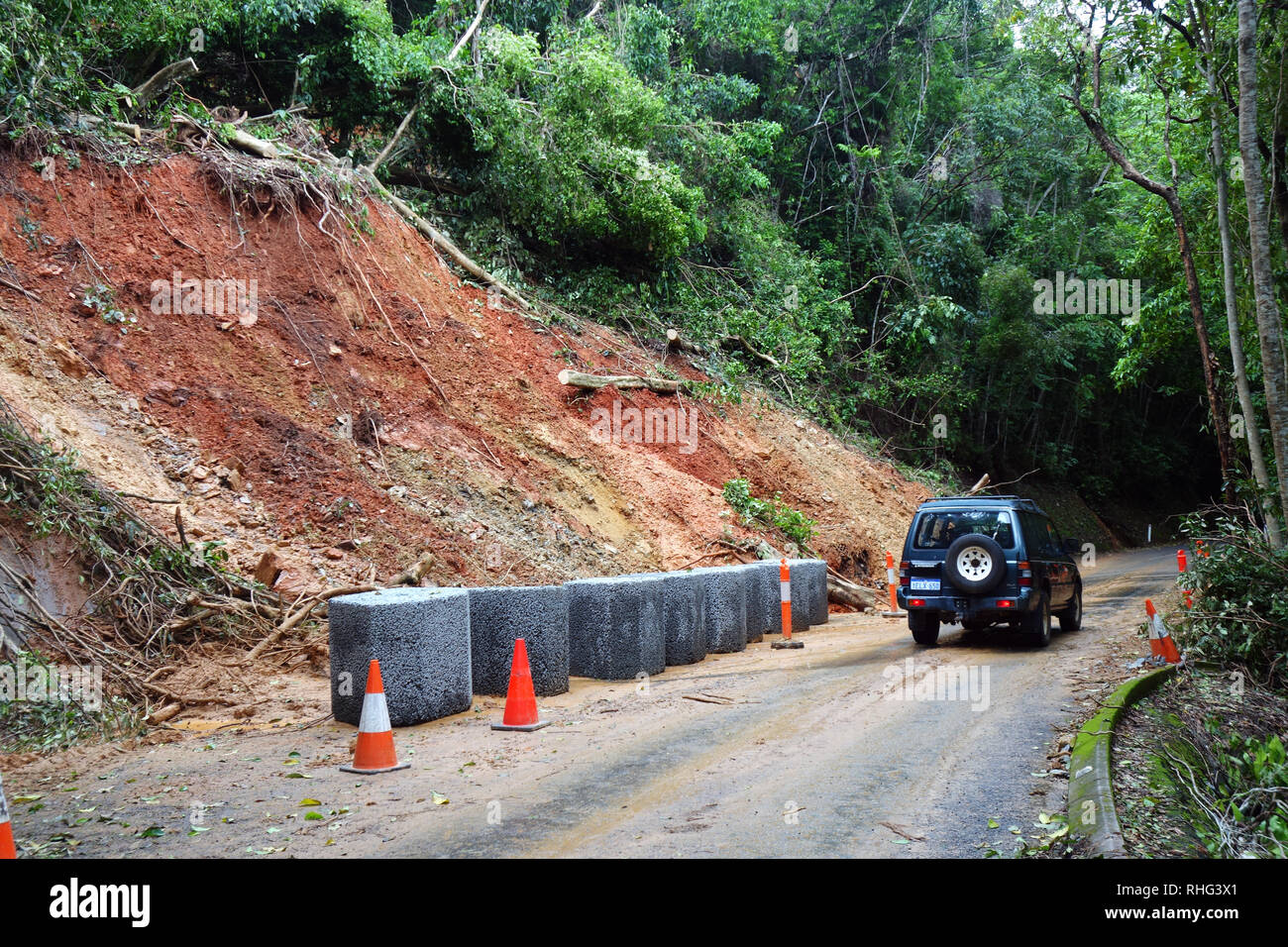 Landslip beside road due to wet season rains, Crystal Cascades Road, Redlynch, Cairns, Queensland, Australia. No PR Stock Photo