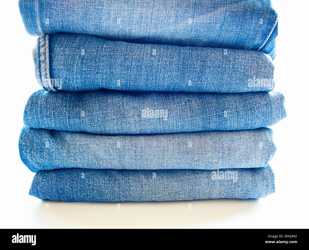 Pile of different blue jeans, fabric texture Stock Photo
