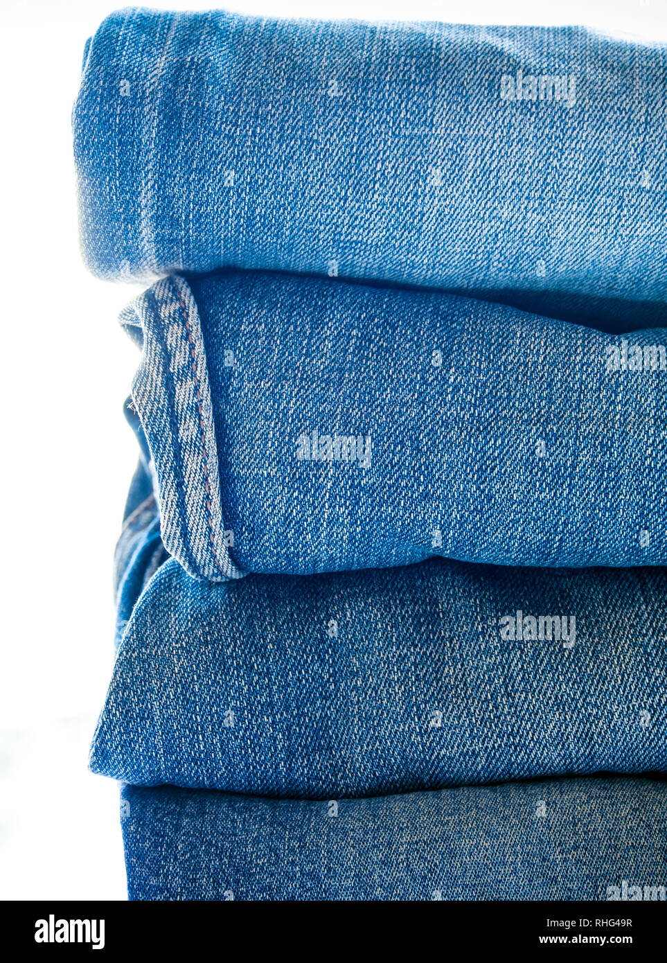 Pile of different blue jeans, fabric texture Stock Photo