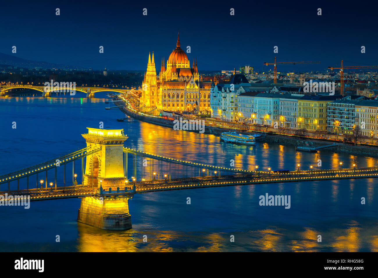 Fantastic European touristic travel destination. Amazing cityscape panorama with famous iluminated Chain bridge and Hungarian Parliament building on D Stock Photo