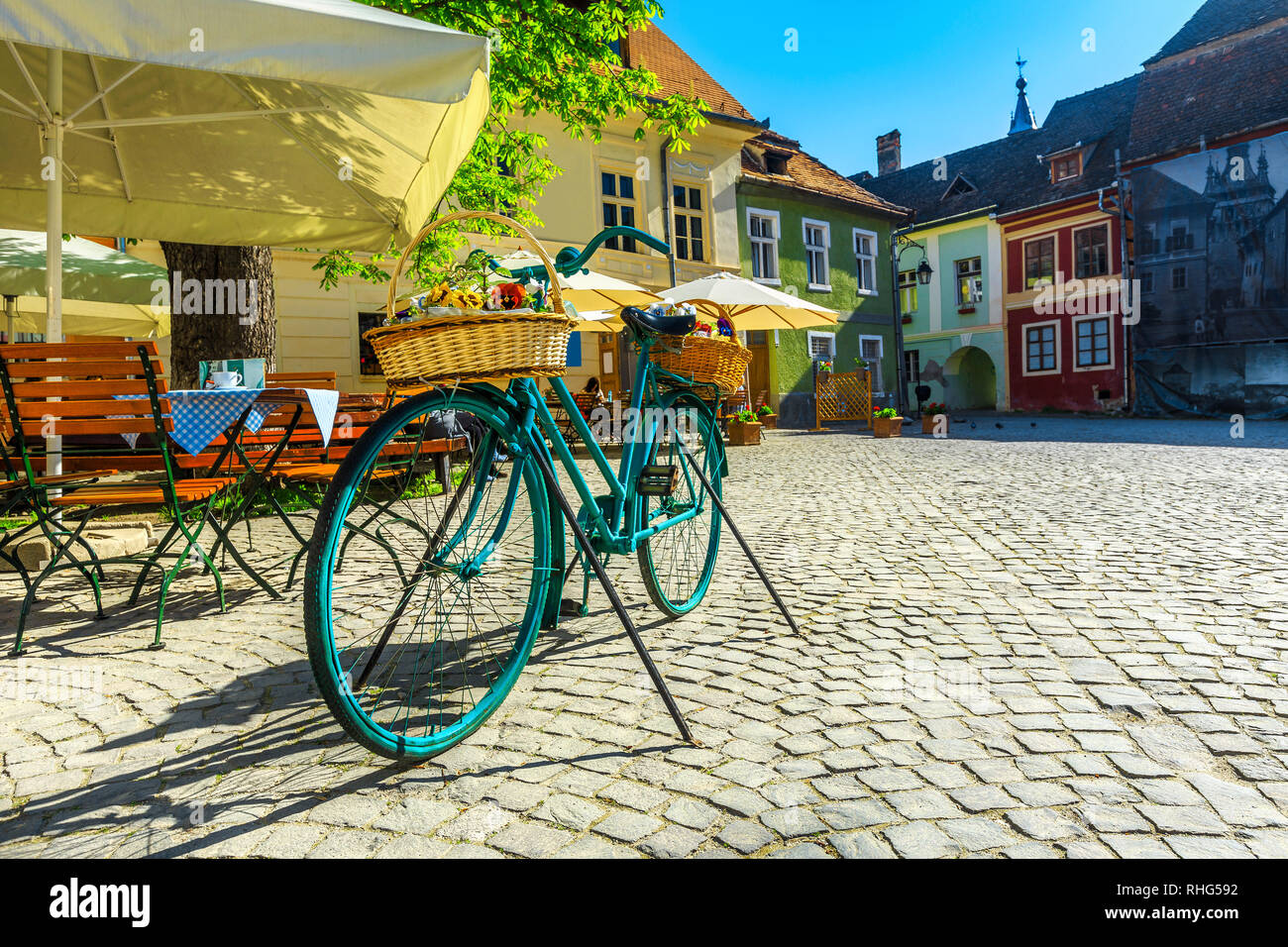 Fantastic travel destination, recreation and resting place with street cafe bar. Traditional colorful buildings and spectacular promenade, Sighisoara, Stock Photo